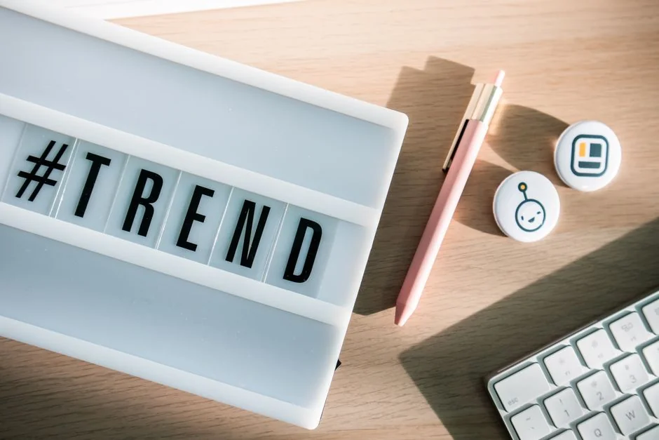 Open planner beside a keyboard with Hashtag Campaign written by hand. A perfect fit for social media and productivity themes.