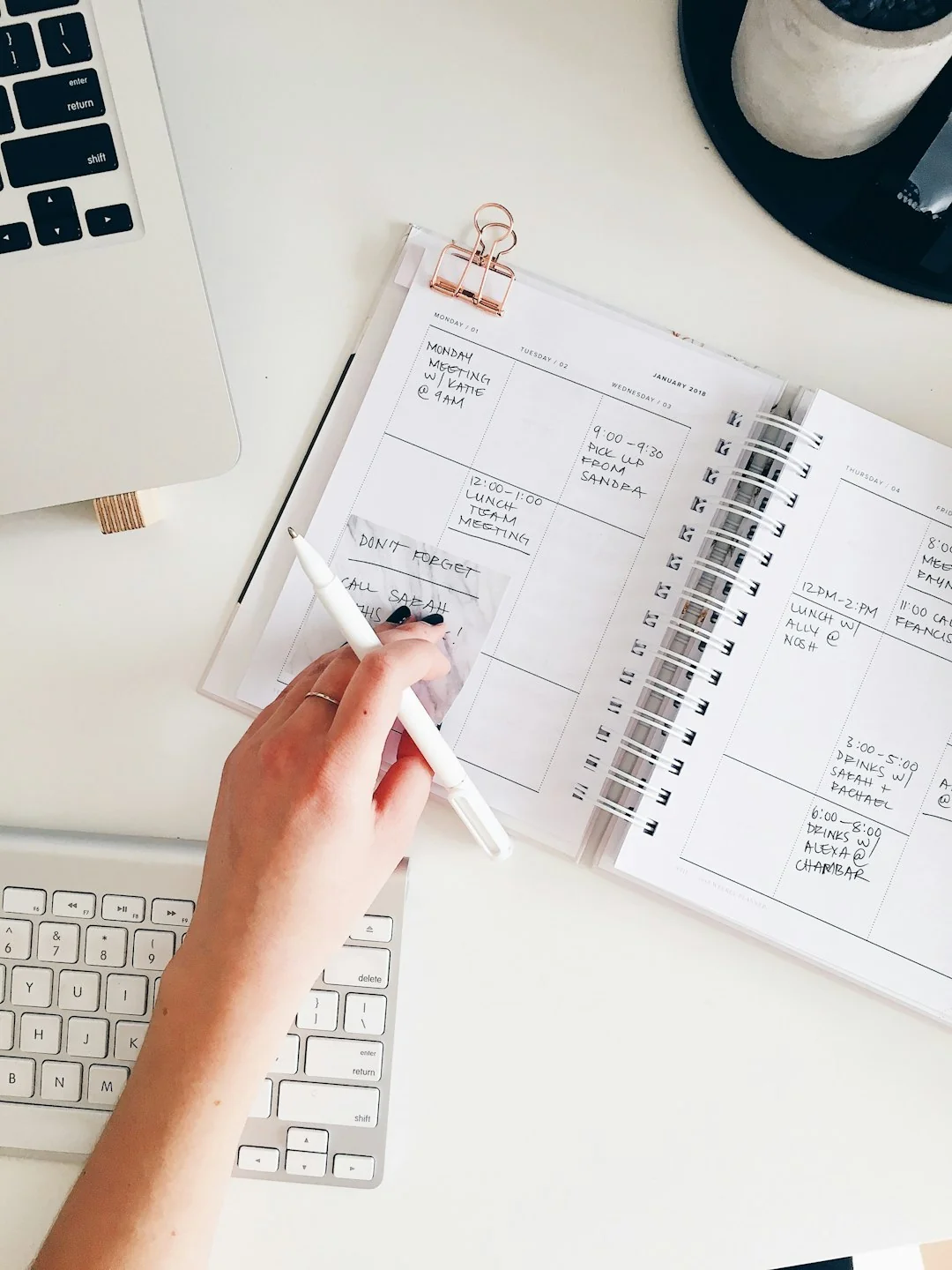 Sticky notes with holiday marketing ideas for Christmas social media and email campaigns.